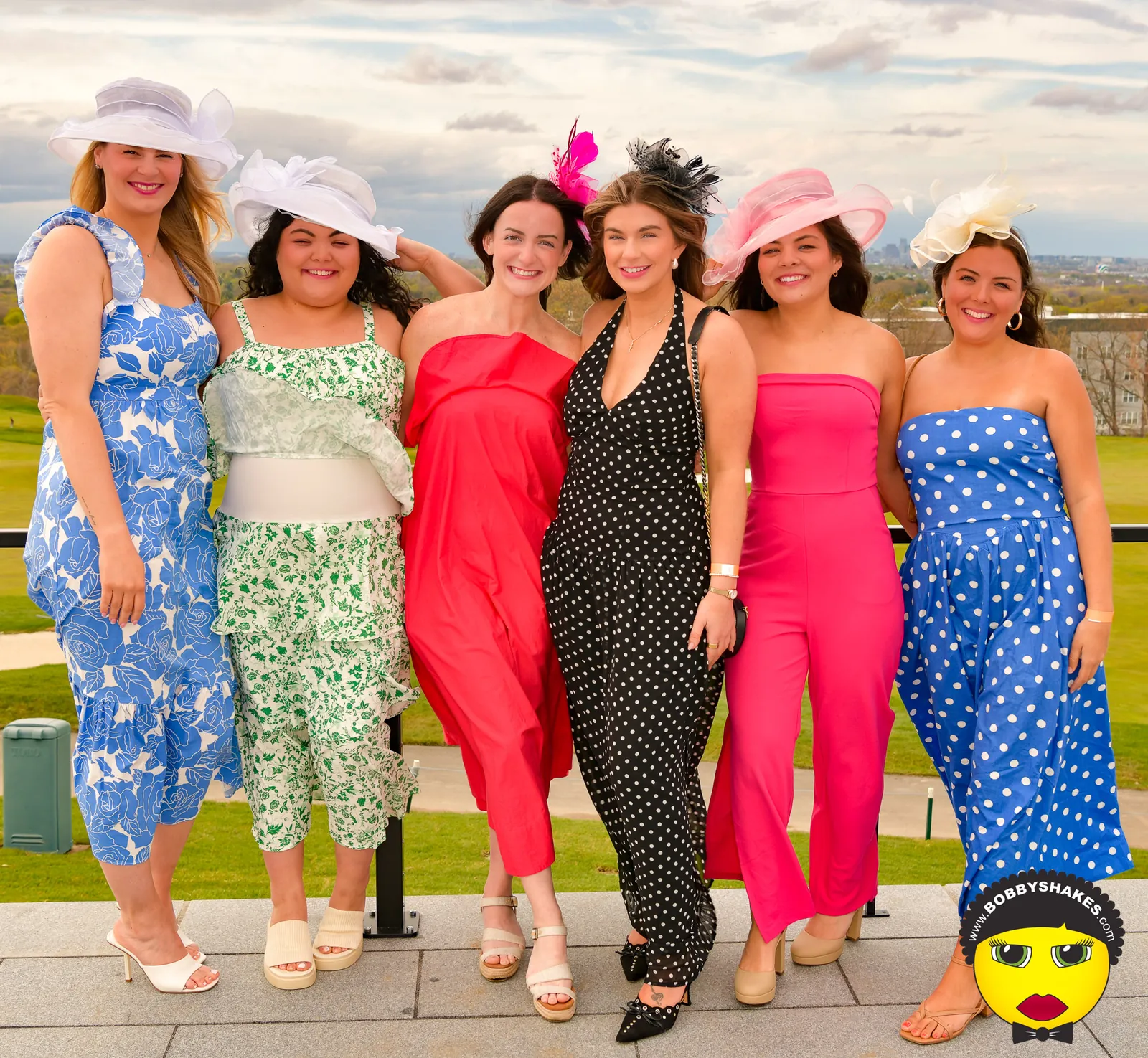 Friends in bright jumpsuits and Derby hats at SCHDOR’s 2026 Kentucky Derby Day Party in Boston